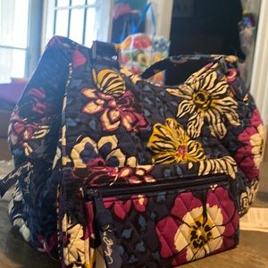 Vera Bradley hand bag and wallet. floral and purple leopard print inside.